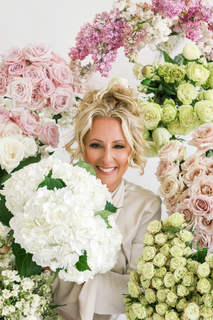 florist surrounded by roses and hydrangeas Mother’s Day flowers Leamington Ontario