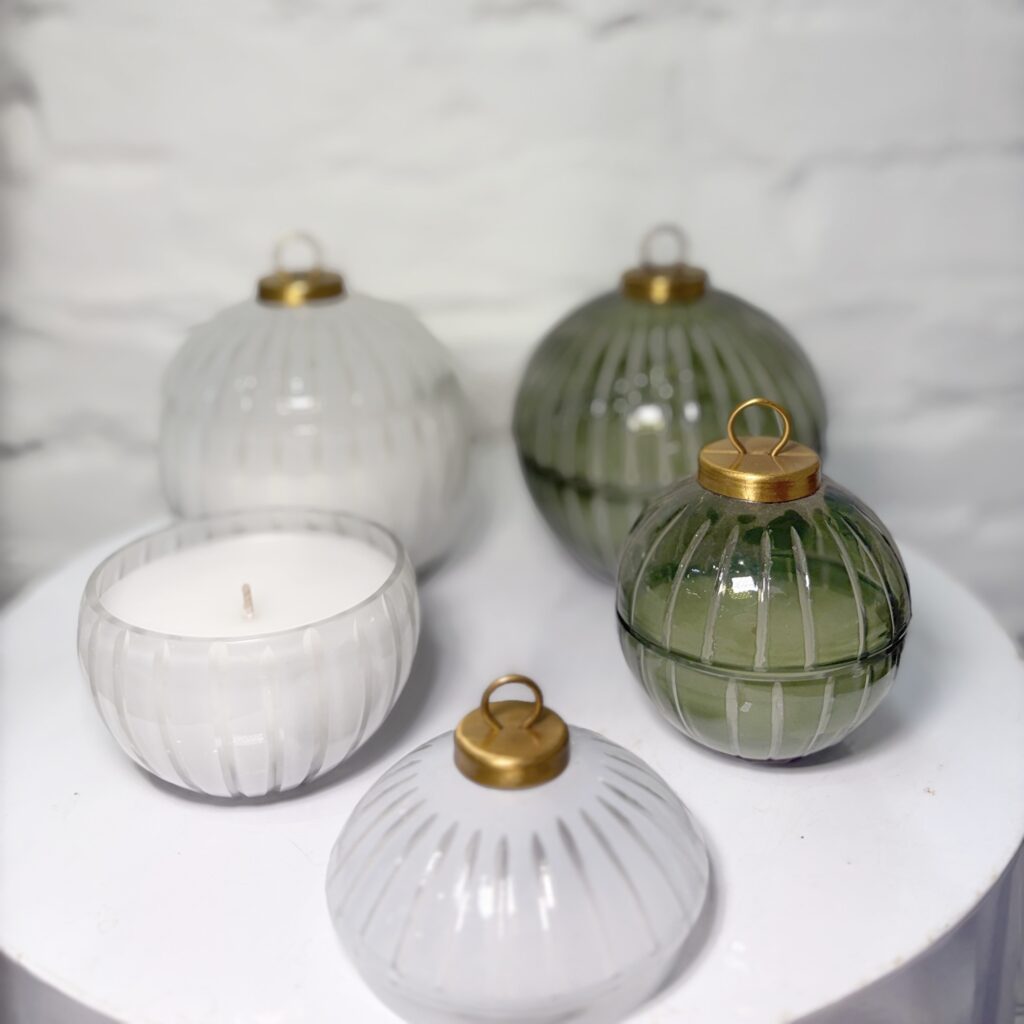 ribbed-glass ornament candles, available in white or sage green