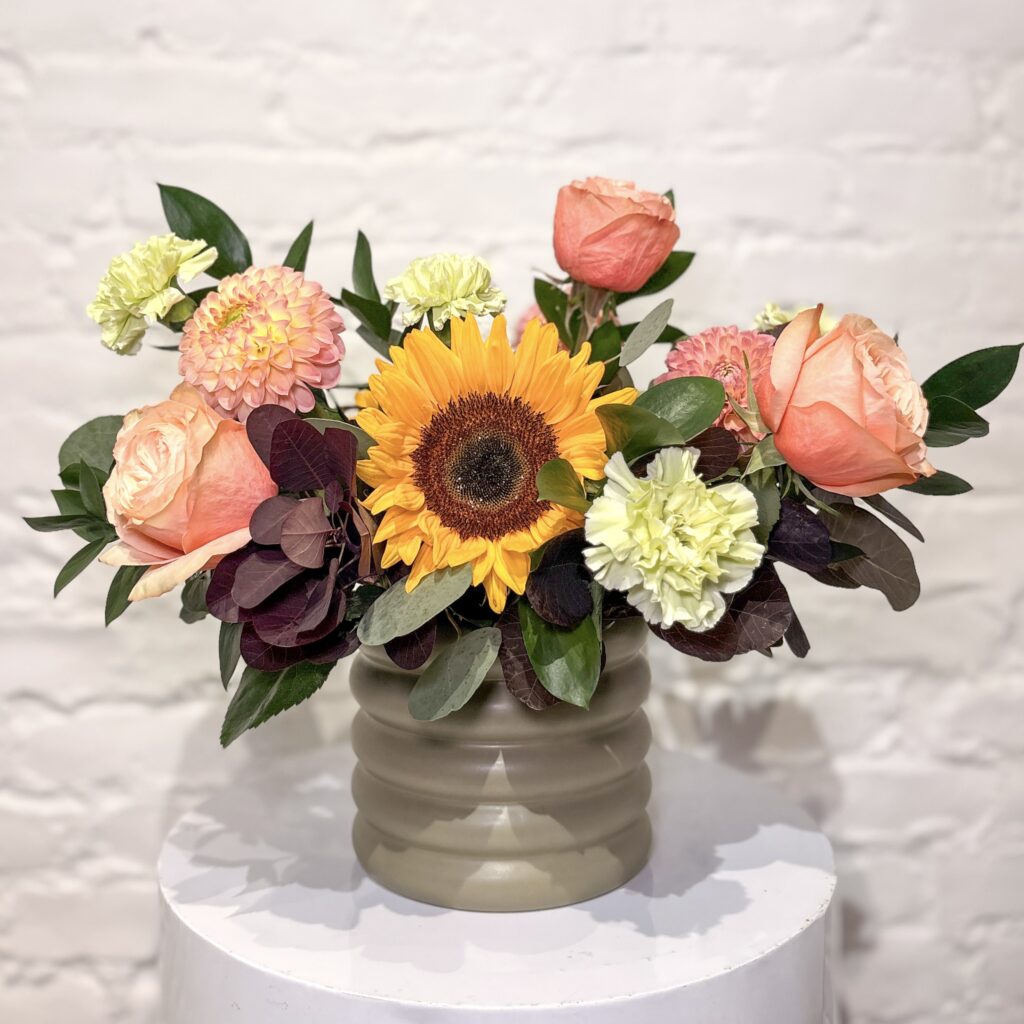 Garden Gather flower arrangement with sunflowers, roses, dahlias, carnations, smokebush and fresh greens